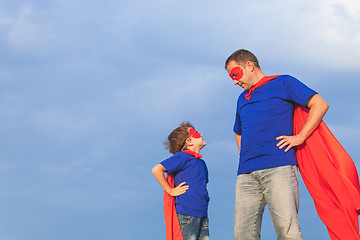 Image showing Father and son playing superhero at the day time.