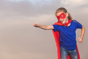 Image showing Happy little child playing superhero.