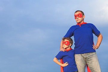 Image showing Father and son playing superhero at the day time.