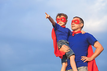 Image showing Father and son playing superhero at the day time.