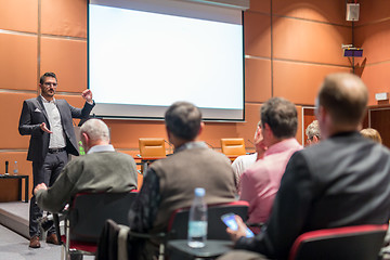 Image showing Business speaker giving a talk at business conference event.