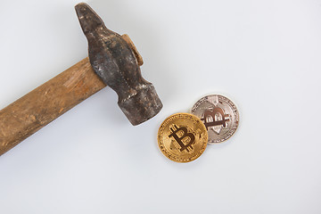 Image showing Bitcoin coins with hammer