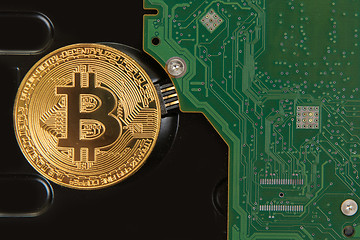 Image showing Bitcoin coin with HDD