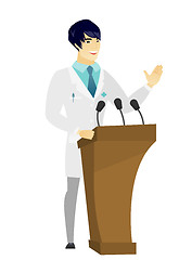 Image showing Doctor giving a speech from tribune.