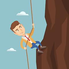 Image showing Business man climbing on the mountain.