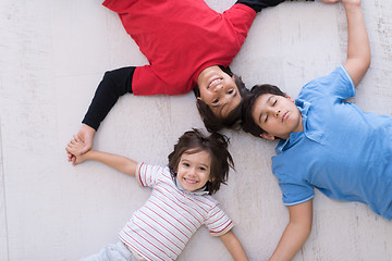 Image showing young boys having fun on the floor