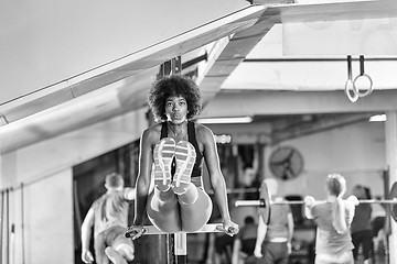 Image showing black woman doing parallel bars Exercise