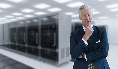 Image showing Senior businessman in server room