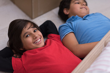 Image showing young boys having fun on the floor