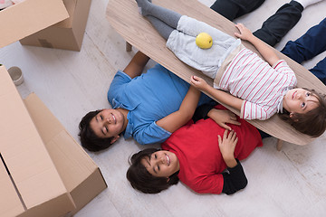 Image showing boys with cardboard boxes around them top view