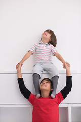 Image showing young boys posing line up piggyback