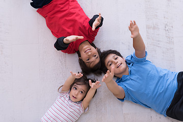 Image showing young boys having fun on the floor