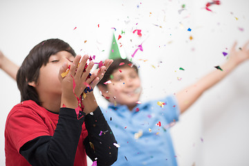 Image showing kids  blowing confetti