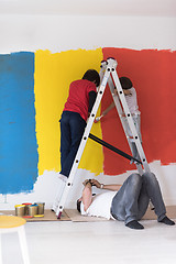 Image showing boys painting wall