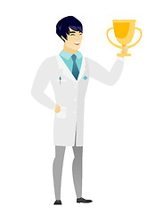 Image showing Asian doctor holding a golden trophy.