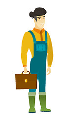 Image showing Asian farmer holding briefcase.