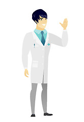 Image showing Young asian doctor waving his hand.