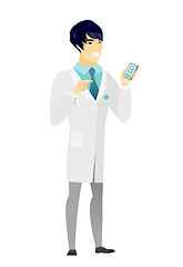 Image showing Asian doctor holding a mobile phone.