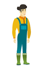 Image showing Young asian happy farmer in coveralls.