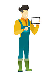 Image showing Smiling farmer holding tablet computer.