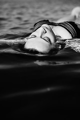 Image showing Woman floating on water