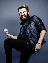 Image showing portrait of young bearded hipster guy on gray dark background close up, brutal modern man, lifestyle people concept 