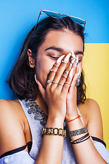 Image showing lifestyle people concept. young pretty smiling indian girl with long nails wearing lot of jewelry rings, asian summer happy