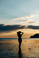 Image showing Female silhouette in water