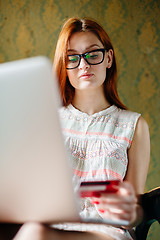 Image showing Woman using card for purchase