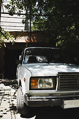 Image showing Sensual model posing on car