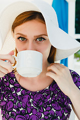 Image showing Model in summer outfit drinking coffee