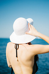 Image showing Anonymous model in swimwear and hat