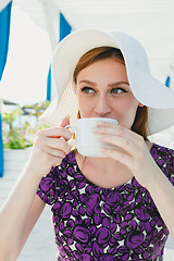 Image showing Model in summer outfit drinking coffee