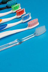 Image showing Photo of multi colored toothbrushes