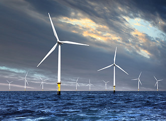 Image showing wind turbines under cloud sky