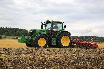 Image showing John Deere Tractor and Horsch Cultivator on Stubble Field