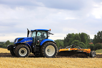 Image showing New Holland T7 Tractor and Field Leveller at Work