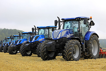 Image showing Row of New Holland Tractors