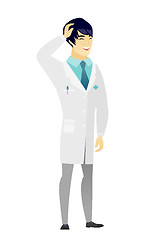 Image showing Young asian doctor in medical gown laughing.