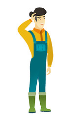 Image showing Young asian farmer in coveralls laughing.