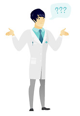 Image showing Asian confused doctor with spread arms.