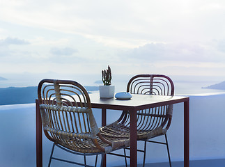 Image showing The two chairs and a small table on beautiful terrace with wonderful sea view