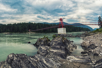 Image showing suspension bridge on mountain river