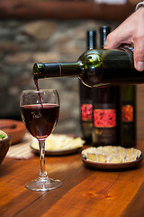 Image showing Pouring red wine