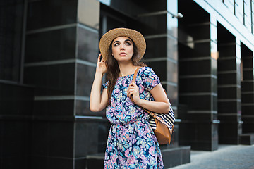 Image showing The fashion woman portrait of young pretty trendy girl posing at the city in Europe