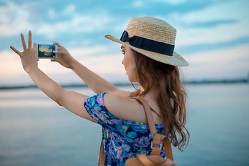 Image showing Young woman and river at city