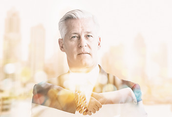 Image showing Double exposure of senior businessman