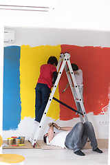 Image showing boys painting wall