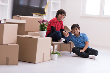 Image showing boys with cardboard boxes around them