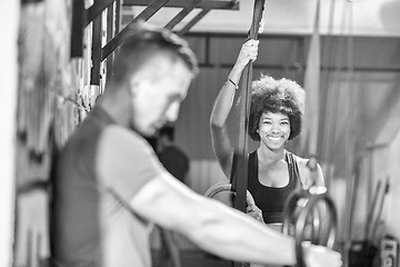 Image showing Portrait of multiethnic couple  after workout at gym